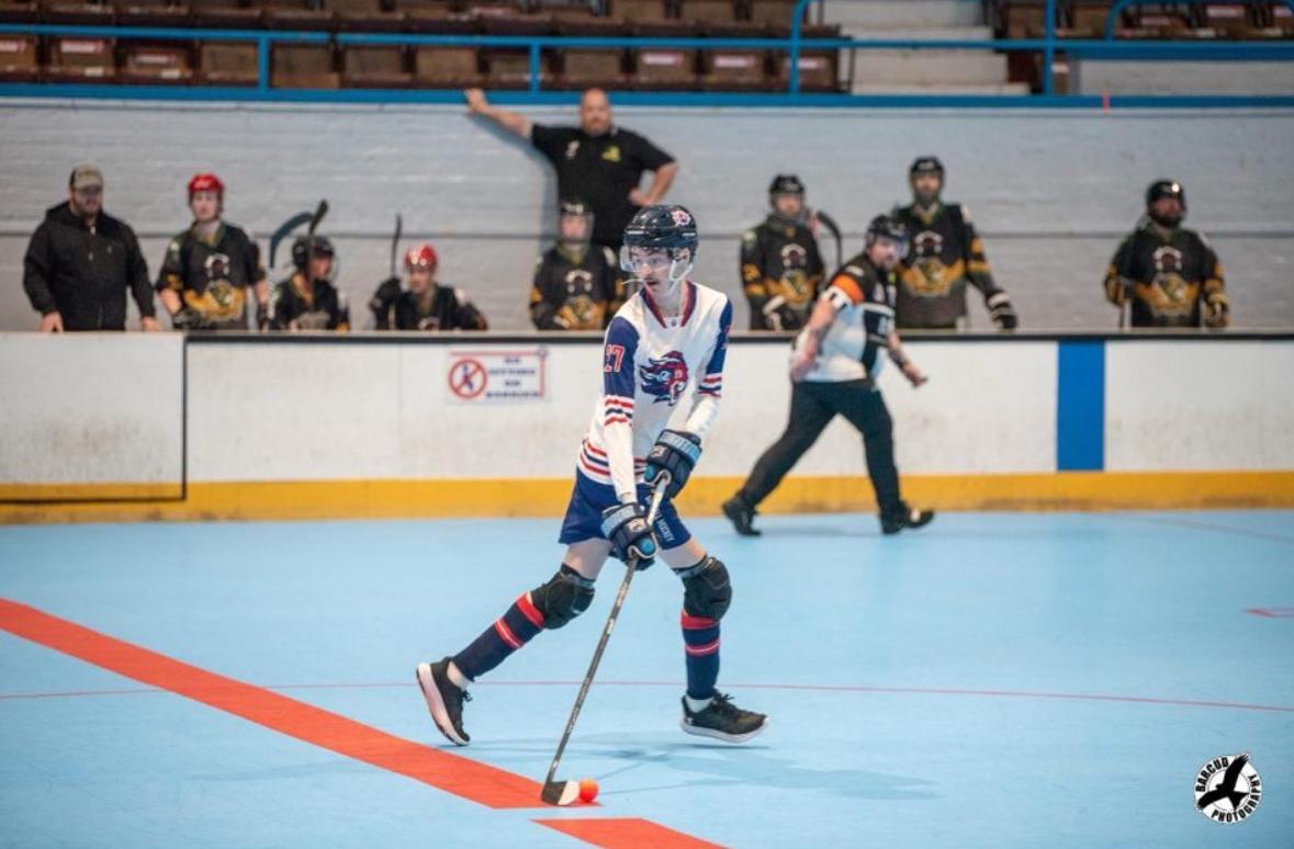 Ethan playing hockey