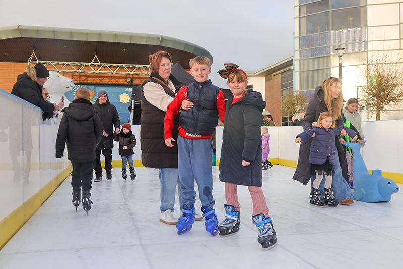 A family on an ice rink