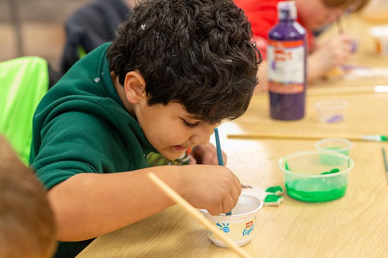 A boy doing some crafts