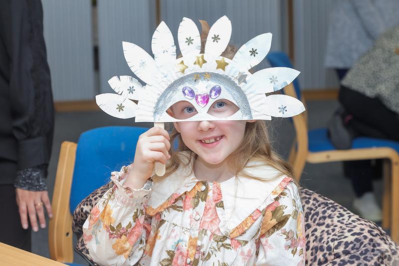 A girl holding a mask